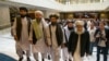 FILE: Mullah Abdul Ghani Baradar, the Taliban group's top political leader, third from left, arrives with other members of the Taliban delegation for talks in Moscow in May 2019.