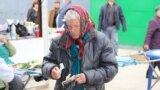 Moldova - Nisporeni, market, old woman, money, lei, pensioners, poverty