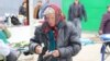 Moldova - Nisporeni, market, old woman, money, lei, pensioners, poverty