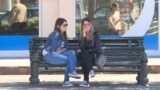Montenegro -- Young women sitting in a park in Podgorica (people, woman, street, chat, chatting), May 23, 2019.