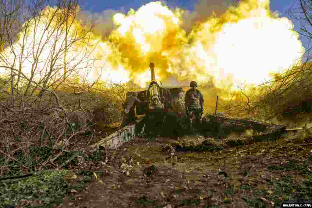 A Ukrainian soldier of an artillery unit fires toward Russian positions outside Bakhmut in the Donetsk region on November 8.