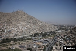 Telecom antennas on top of a hill in Kabul