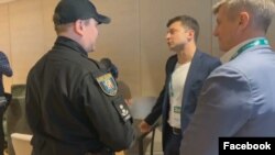 Volodymyr Zelenskiy (second from right), the apparent next president of Ukraine, was fined by police for showing his marked ballot.