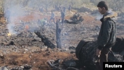 Місце падіння збитого урядового літака на півночі Сирії