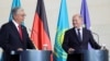 German Chancellor Olaf Scholz (right) meets with Kazakh President Qasym-Zhomart Toqaev in Berlin on September 28.