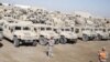 U.S. soldiers check military vehicles to be shipped as troops prepare to pull out of a military base in Nasiriyah last month.