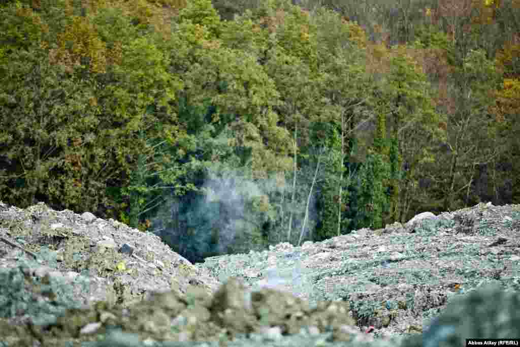 Waste smolders on the dump. Locals worry that the fumes are toxic.