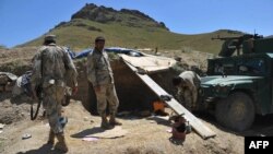 Afghan border police take up positions in the district of Goshta in Nangarhar Province, on the border between Afghanistan and Pakistan on May 2.