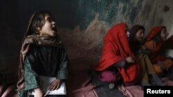 Pakistani girls attend class at a school in a slum outside of Islamabad. Abdul Razzaq was well-known for his activities supporting education for girls.