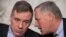 Președintele și vicepreședintele comisiei senatoriale, Richard Burr (dreapta) și Mark Warner (stânga)