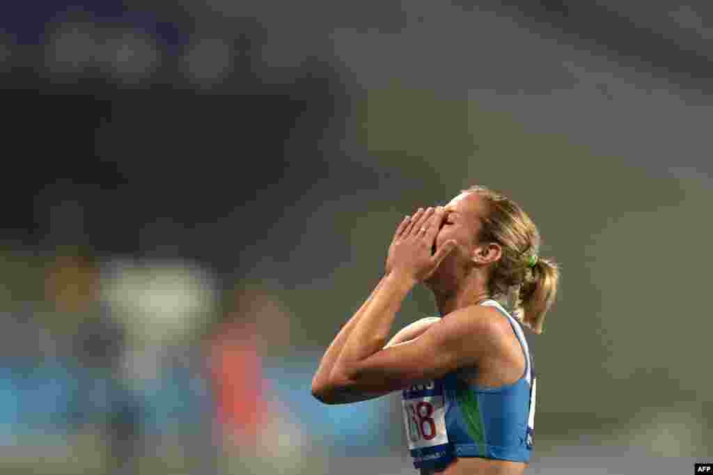 Uzbekistan&#39;s Ekaterina Voronina celebrates after winning her heat in the women&#39;s heptathlon 800-meters&nbsp;athletics event and winning gold in the overall heptathlon competition during the 17th Asian Games at the Incheon Asiad Main Stadium in Incheon, South Korea, on September 29. (AFP/Manan Vatsyayana) 