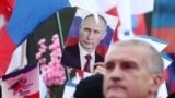 Фотография Владимира Путина на мероприятиях, посвященных седьмой годовщине аннексии Крыма с Россией в Симферополе. 2021 год