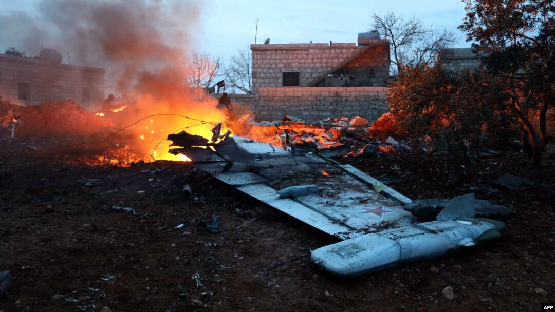 Smoke billows from the site of a downed Su-25 fighter jet in Syria's northwest province of Idlib on February 3.