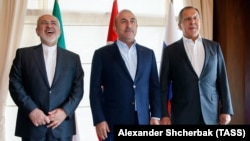 (From left to right) Iranian Foreign Minister Mohammad Javad Zarif, Turkish Foreign Minister Mevlut Cavusoglu, and Russian Foreign Minister Sergei Lavrov in Antalya on November 19. 