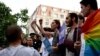 Activists involved in planning "Tbilisi Pride" gather on the steps near the main Georgian government building on JUne 14.