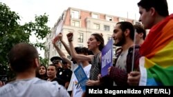 Activists involved in planning "Tbilisi Pride" gather on the steps near the main Georgian government building on JUne 14.