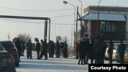 Kazakhstan - Miners and their relatives at the entrance to the territory of the mine "Tentekskaya", where coal miners protest. Karaganda region, 12Dec2017.