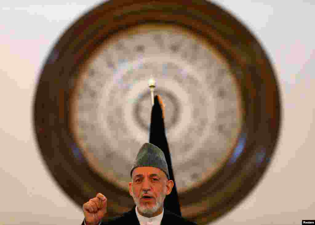 Karzai gives a farewell speech&nbsp;during a gathering of government employees in Kabul on&nbsp;September 23, 2014. Karzai blamed the United States for his country&#39;s long war, a final swipe at the country that helped bring him to power 13 years ago but toward which he has become increasingly bitter. 