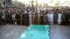 FILE: A funeral of Pakistani fighters killed in Syria in Qom.