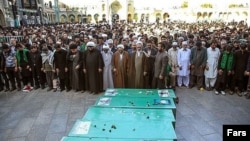 FILE: A funeral of Pakistani fighters killed in Syria in Qom.