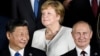 Çin prezidenti Xi Jinping (solda), Almaniya kansleri Angela Merkel və Rusiya prezidenti Vladimir Putin G20-nin 2018-ci il sammitində