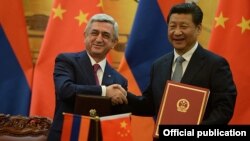 China - President Xi Jinping and his visiting Armenian counterpart Serzh Sarkisian adopt a joint declaration after talks in Beijing, 25Mar2015.