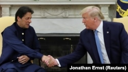 U.S. President Donald Trump (right) greets Pakistan's Prime Minister Imran Khan on July 22 at the White House.