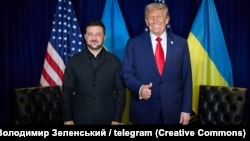 US President Donald Trump (right) gestures to reporters while at a bilateral meeting with Ukrainian President Volodymyr Zelenskyy in New York City on September 23. 