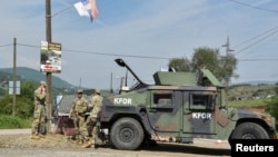 Members of the KFOR peacekeeping force patrol an area near Kosovo's border with Serbia. (file photo)