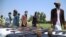 Former Taliban and other militants surrender their weapons during a reconciliation ceremony in Jalalabad on June 25.