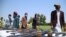 Former militants surrender their weapons during a reconciliation ceremony in Jalalabad on June 25. Many Afghans worry that the impending peace talks will not protect human rights should the hard-line group regain a role in power.