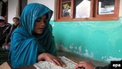 An Afghan girl learns to read the Koran, at a seminary in Jalalabad (file photo)