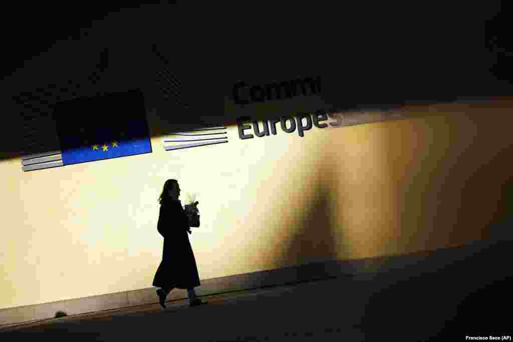 A woman walks outside the European Commission headquarters in Brussels. (AP/Francisco Seco)