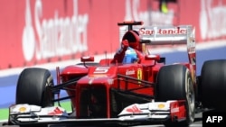 Spain -- Ferrari's Spanish driver Fernando Alonso celebrates winning at the Valencia Street Circuit in Valencia during the European Formula One Grand Prix, 24Jun2012 