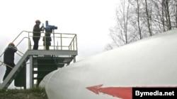 Workers at a station on the Druzhba pipeline in Belarus