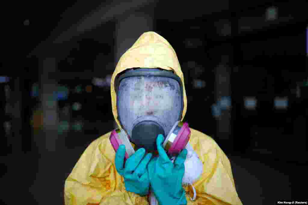 A woman takes part in an antiterror drill as a part of the Ulchi Freedom Guardian exercise in Goyang, South Korea, on August 21. (Reuters/Kim Hong-ji)