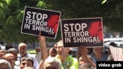 Armenia - members of the Yazidi religious minority demonstrate in front of the main government building in Yerevan to demand action to aid Yazidis in northern Iraq. roundup screen grab