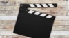 Generic -- Movie clapperboard on wooden background