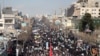 IRAN -- Iranian pro-government supporters march during a rally in support of the regime after authorities declared the end of deadly unrest, in the city of Mashhad on January 4, 2018.