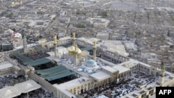 Shi'ite pilgrims begin to gather at the Imam Musa al-Kadhim Mosque in northern Baghdad on July 7.