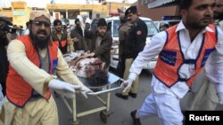 Medics assist a man injured by suicide bomb attacks in Pakistan's northwestern Mohmand region.