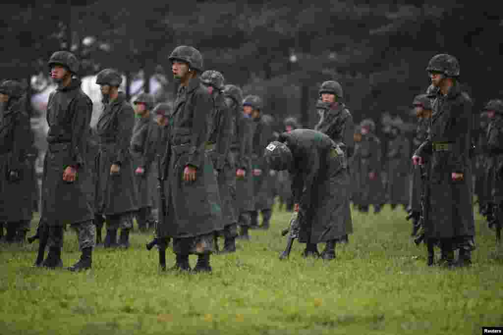 A South Korean soldier checks his weapon before a ceremony in Yangju to commemorate the Korean War's battle of the Nevada Cities. (Reuters/Kim Hong-Ji)