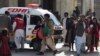 Christians are evacuated by security personnel from a Methodist church after a suicide bomber attacked during a Sunday service in Quetta on December 17.