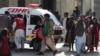 Christians are evacuated by security personnel from a Methodist church after a suicide bomber attacked during a Sunday service in Quetta on December 17.