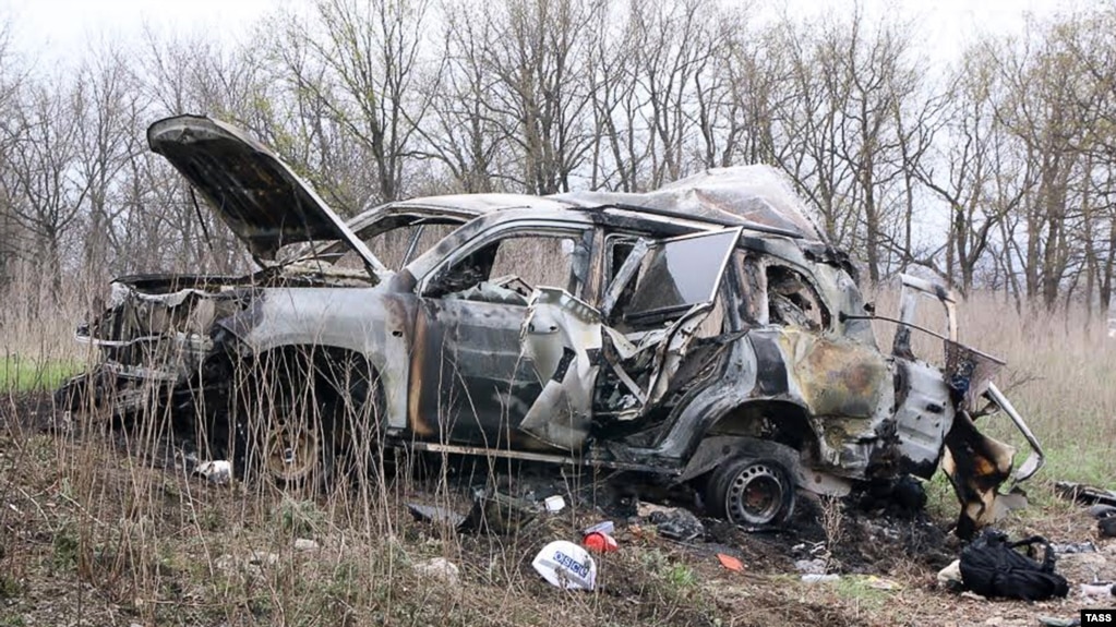 A burned-out OSCE vehicle that hit a land mine in eastern Ukraine on April 23, killing one paramedic.