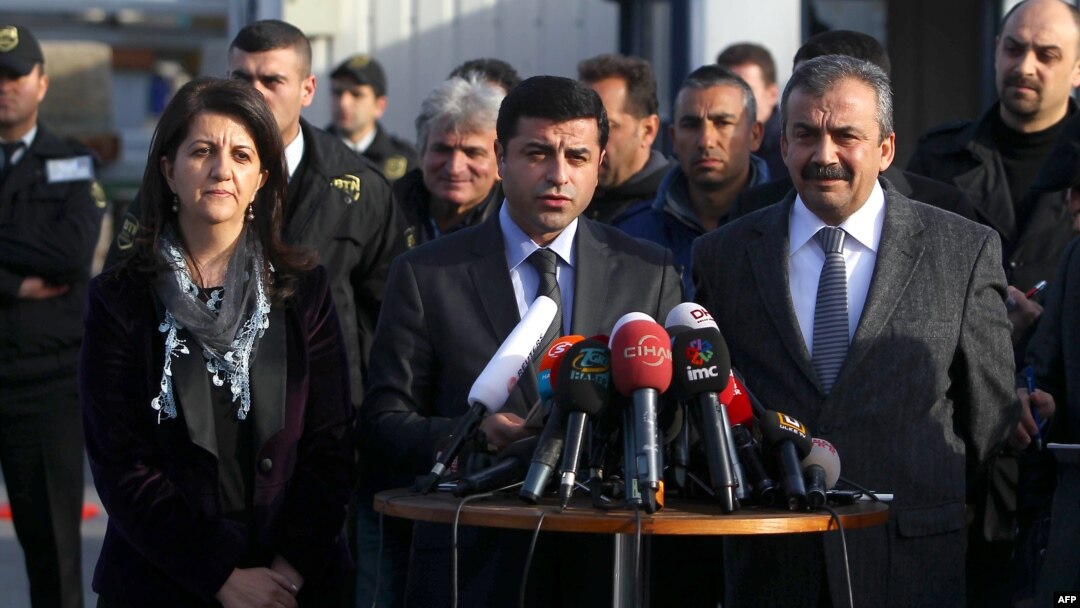 Turkey -- Pro-Kurdish Peace and Democracy Party (BDP) co-chairman Selahattin Demirtas (C), pro-Kurdish politicians Sirri Sureyya Onder (R) and Pelvin Buldan (L) give a press conference in Istanbul, 18Mar2013