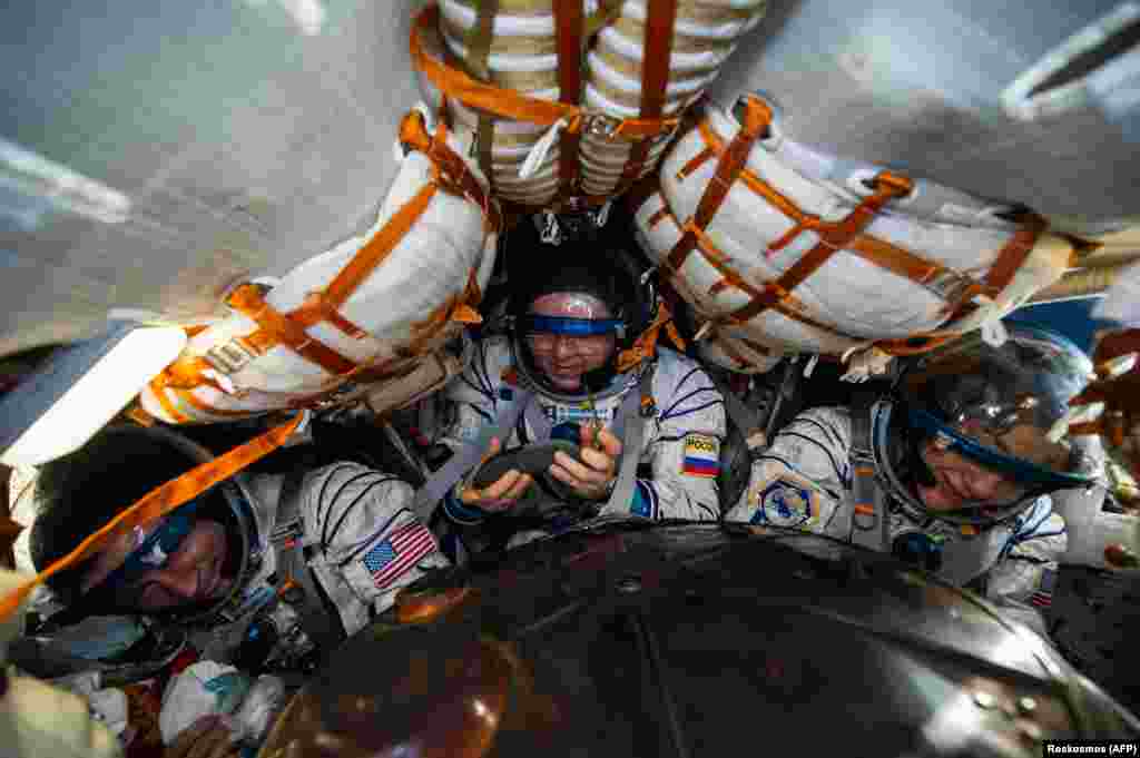 Russian cosmonaut Oleg Skripochka (center) and NASA astronauts Andrew Morgan (left) and Jessica Meir are seen inside the Soyuz MS-15 capsule shortly after landing in a remote area of Kazakhstan on April 17. (AFP/Andrei Shelepin/GCTC/Russian Space Agency Roscosmos)