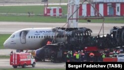 The Aeroflot Sukhoi Superjet-100 is taken off a runway after a crash landing at Sheremetyevo International Airport on May 6.