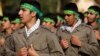 Outgoing Basij commander Hossein Taeb (left) and his replacement, Mohammad Reza Naqdi