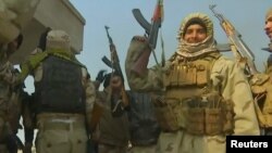 Иракские правительственные подразделения после победы в сражении с ИГ. Окрестности Мосула, 7 декабря 2016 года.